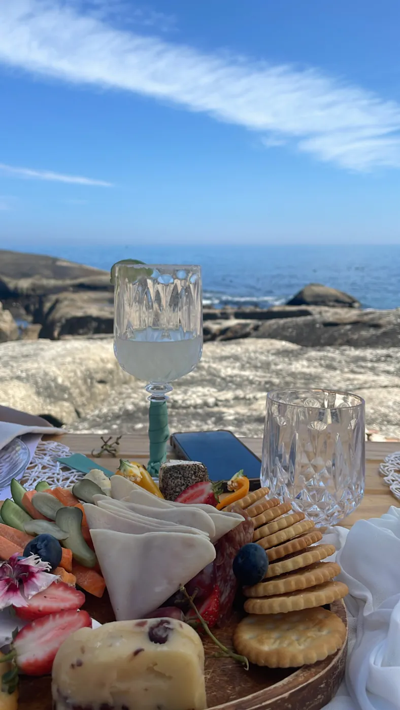 Grazing board and glassware styled by the ocean at a Cape Town bachelorette